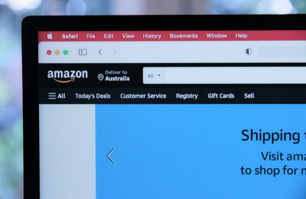 Seller optimizing Amazon product listings and PPC dashboard with SEO tools for higher rankings and conversions.